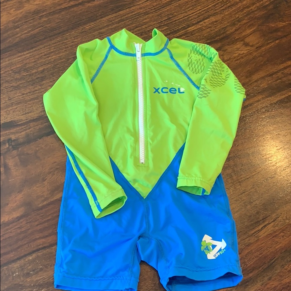 XCEL baby zip up rash guard one piece.